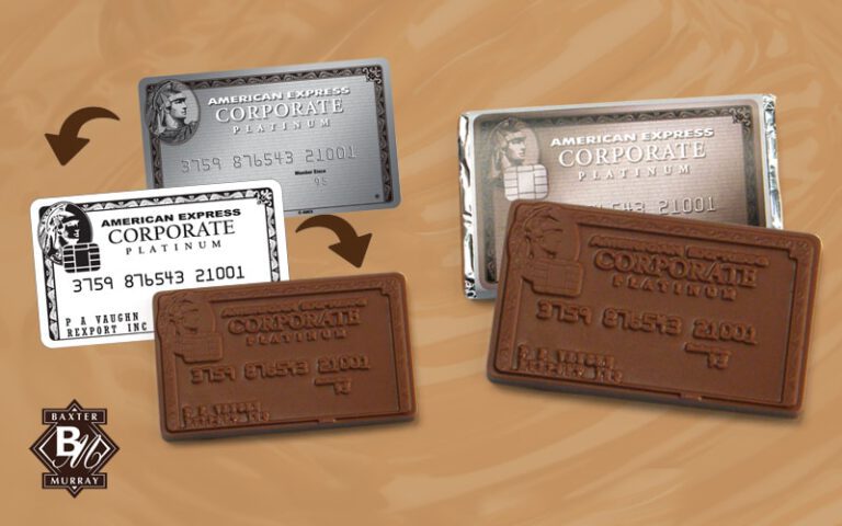Chocolate bars designed to look like American Express Corporate Platinum cards, displayed alongside real cards on a brown surface.