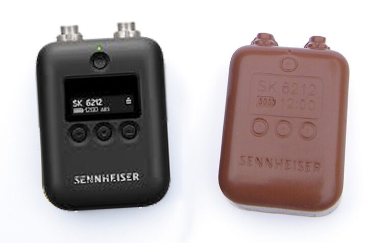 Two Sennheiser SK 6212 wireless transmitters are shown, one in black with a display and buttons, and the other in brown resembling a simpler, rounded design.