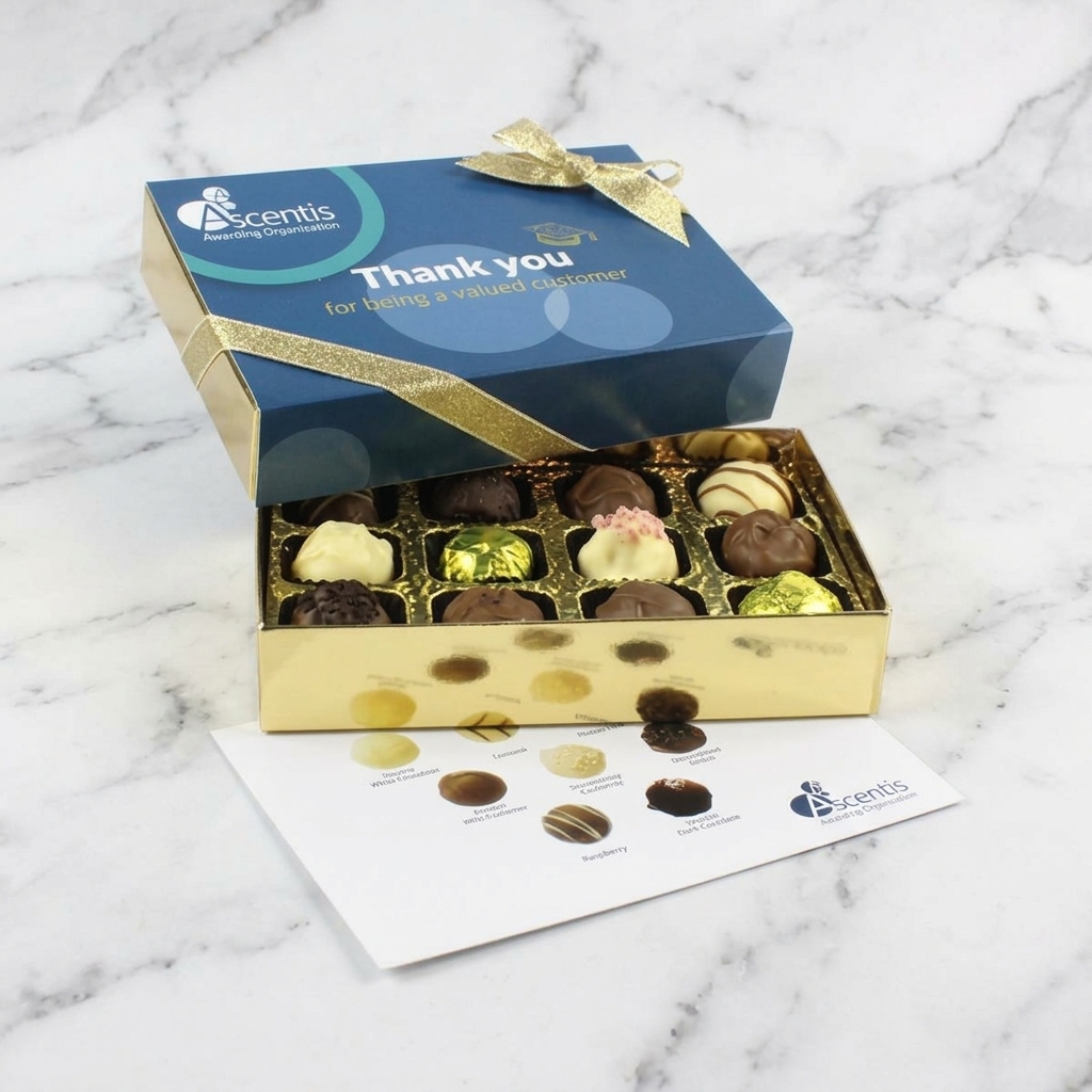 corporate chocolate box of 12 delicious truffles and chocolates in a box with a full colour branded lid, finished with a personalised menu card and hand tied gold ribbon , displayed on a marble surface.