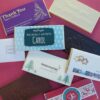 An assortment of personalized chocolate bars with festive and thank you messages displayed on a red background.