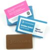 A "Chocolate Business Card Personalised Box" featuring a chocolate bar in "Cornmarket" logo packaging, plus two printed cards detailing a business card holder and the "Golden ticket giveaway" promotion.
