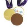 img_0586_-_m2_0724.2 Three Promotional Chocolate Medals wrapped in gold foil with the Google logo, attached to purple ribbons.