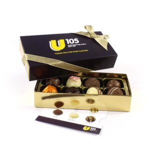 An Eight Chocolate Customised Sleeve Box with a gold ribbon, partially open to display assorted truffles. The lid features "U 105" and the message "Thank you for your custom.
