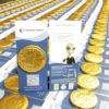 img_8530_-_m2_0624 Stacks of gold-colored chocolate coins with brochures labeled "CoinPayments" and "Crypto payments made EASY" are scattered among them.