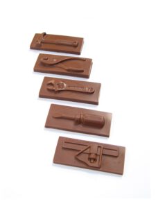 s0439196_v2 Five chocolate bars molded to resemble different tools, including a wrench, pliers, a screwdriver, and a ruler, under the product name "Chocolate Tools.