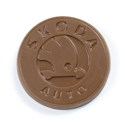 A round piece of chocolate from Skoda Chocolate Gifts embossed with the Skoda Auto logo.