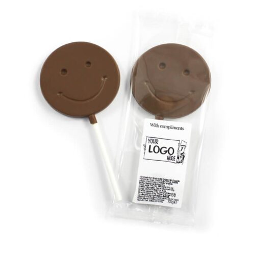 Two Smiley Face Lollipops; one wrapped with a "Your Logo Here" label and the text "With compliments.
