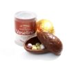 A container of Vaseline Lip Therapy is placed beside a Promotional Easter Egg filled with small candies.