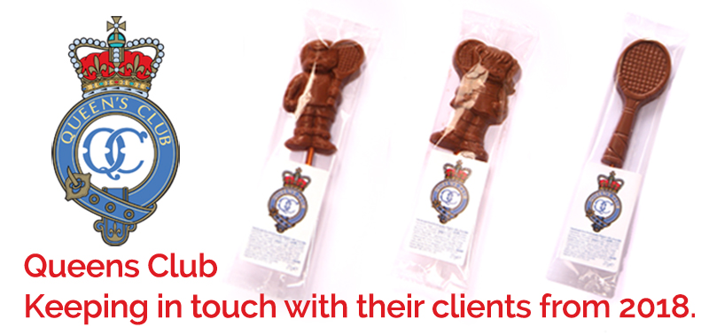 The Queen's Club logo beside three chocolate lollipops shaped like a tennis player, an umpire's chair, and a tennis racquet. Text below reads: Queen's Club Keeping in touch with their clients from 2018.